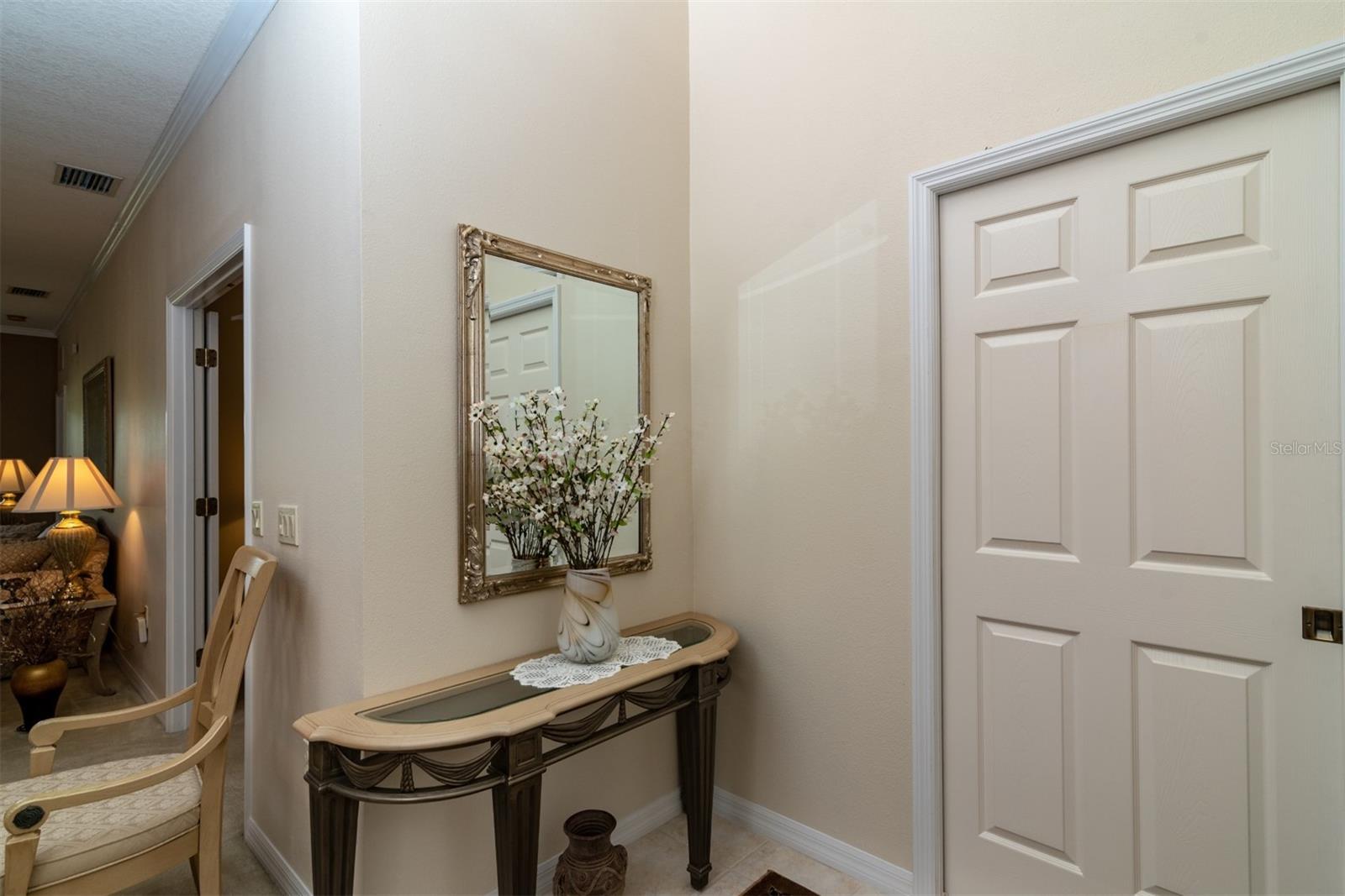 The handy pocketdoor in the foyer can be used to isolated the entire guest suite from the rest of the home.