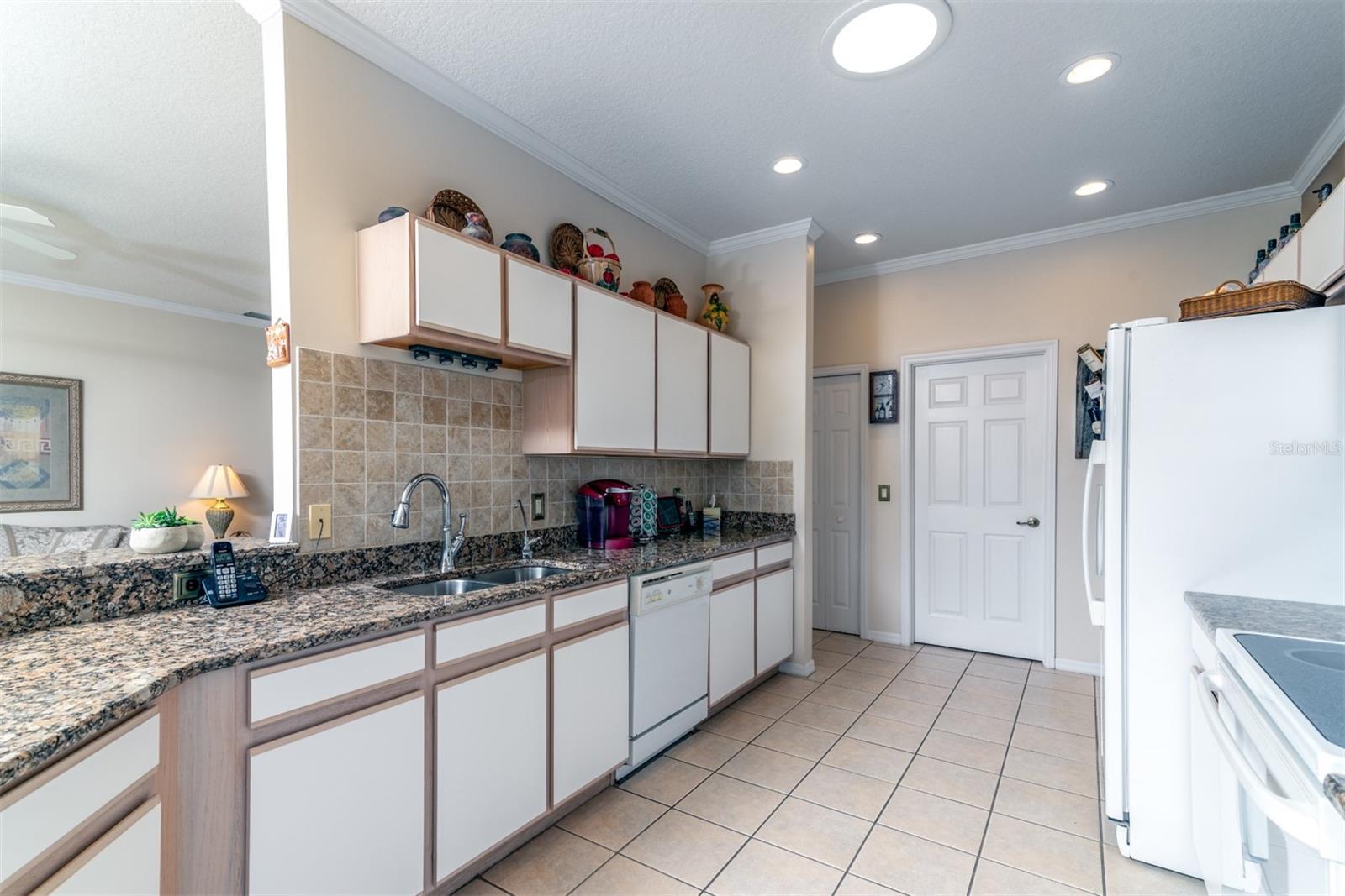 The ample cabinetry and granite countertops will bring a smile to the face of the household chef.