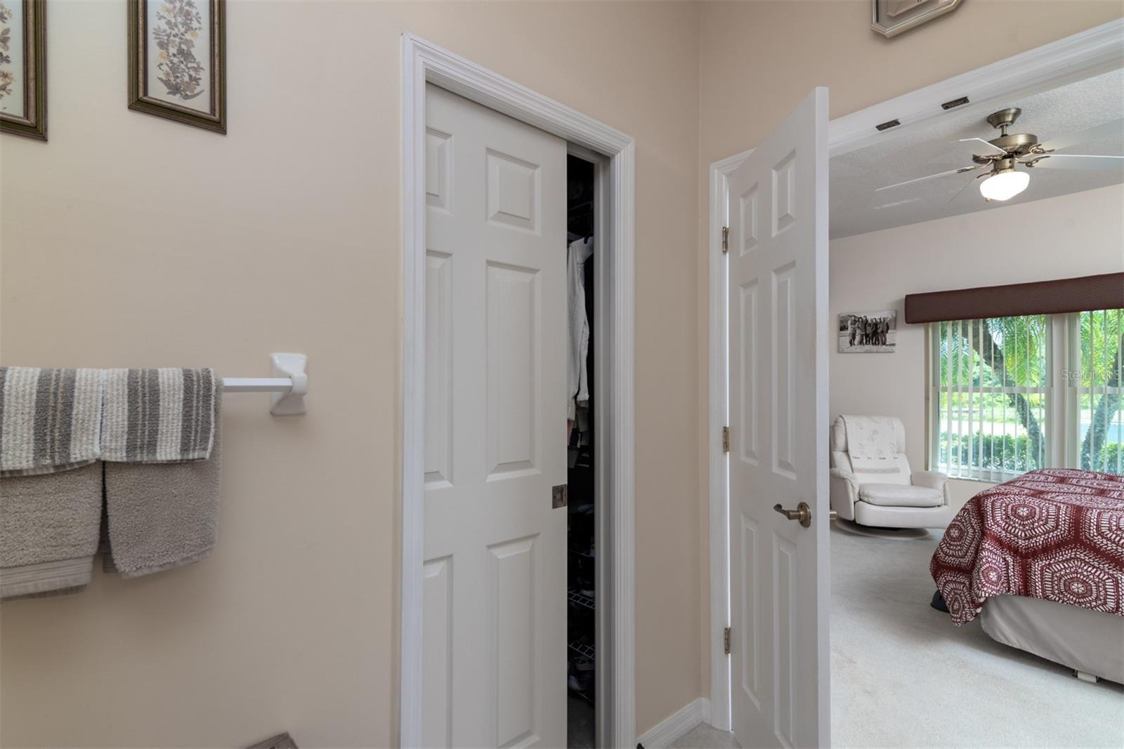 The north walk-in closet has double tier shelving to maximize the space.