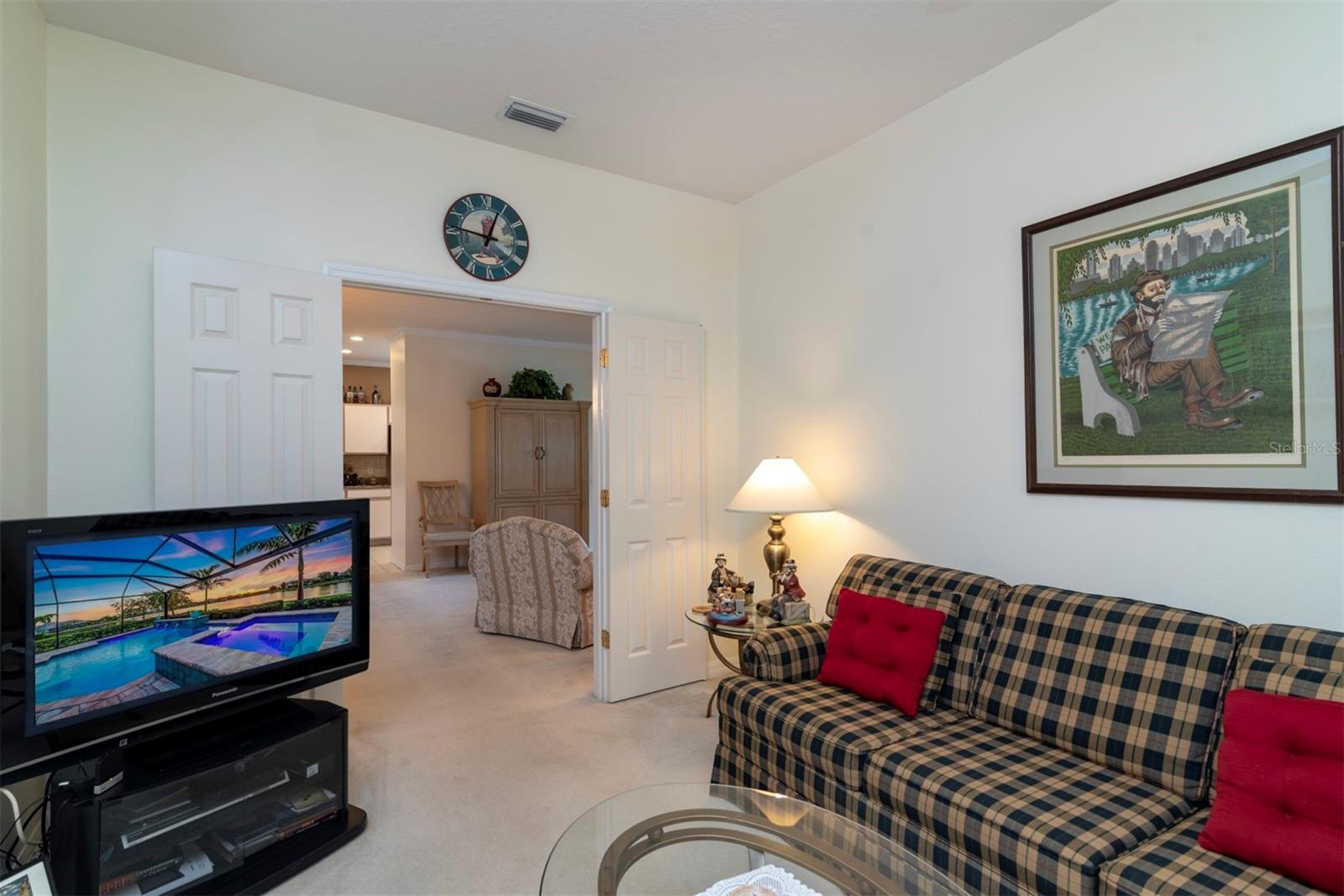 The den can be used for emergency sleeping space. A double door can close off the den from the living room.