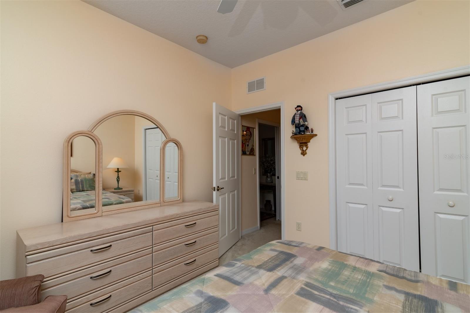 The guest bedroom is adjacent to the guest bathroom and has a large reach in closet.