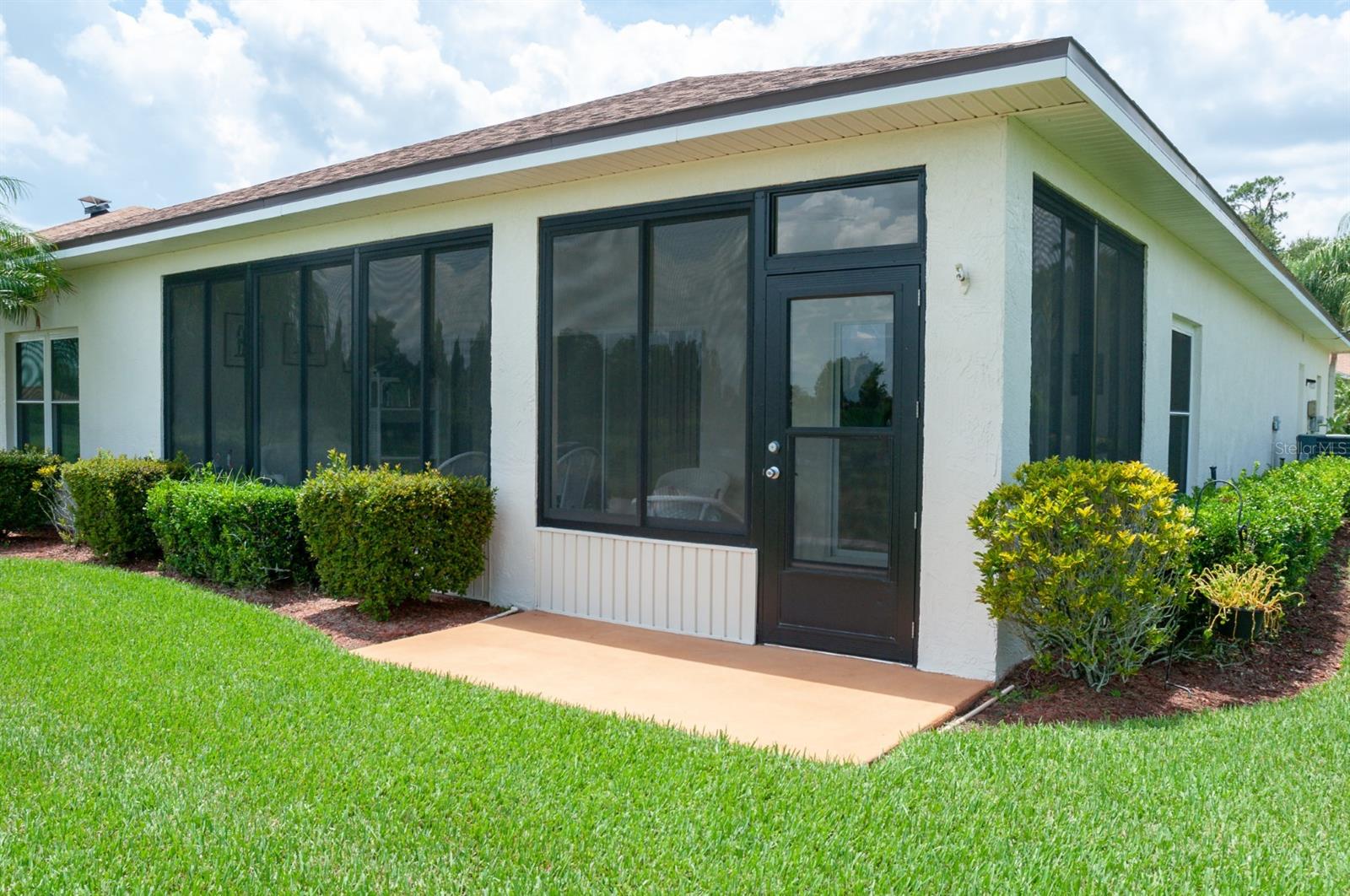 A summer kitchen with a Jenn Air grill is inside the lanai.