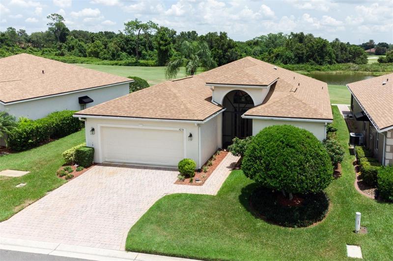 The pave drive and walk enhance the quality landscaping.