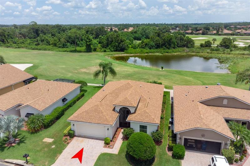 This home is located on the fairway of the 14th hole of Lake Ashton's east course. The pond and nature preserve provide a great view.