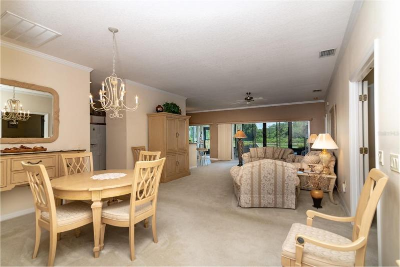 This is the view from the foyer that shows the combination living and dining room, the central core of this beautiful home.