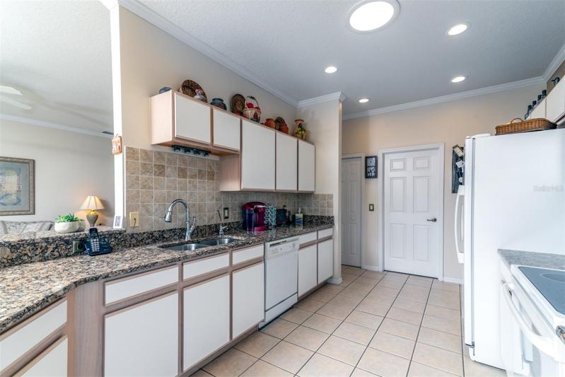 The ample cabinetry and granite countertops will bring a smile to the face of the household chef.