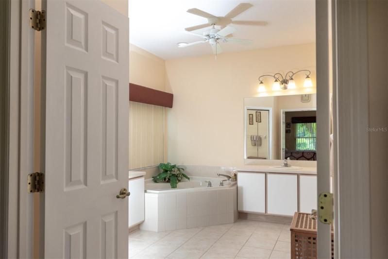The double door can be closed when an early riser and late sleeper share the master suite.