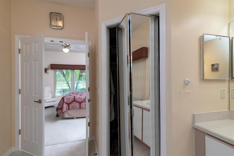 The south walk-in closet has a full length mirrored closet door.