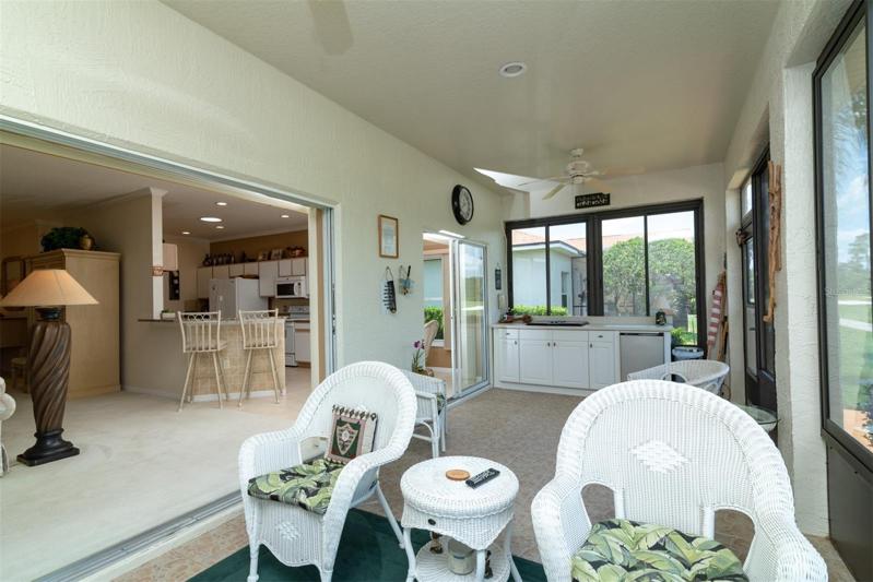 The enclosed lanai has a summer kitchen.