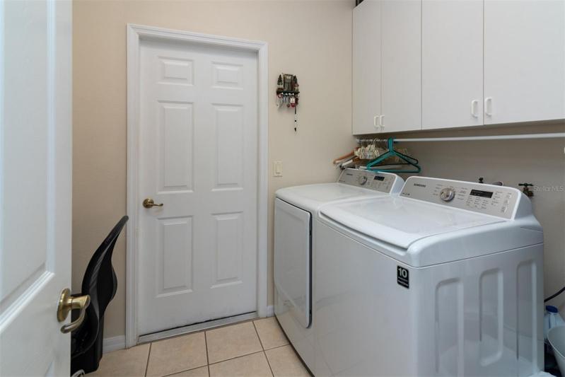 The inside laundry doubles as the mud room for the attached 2 car garage. The washer and dryer stay for the new owners.