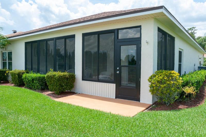 A summer kitchen with a Jenn Air grill is inside the lanai.