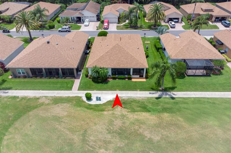The rear of the home has quality landscaping.