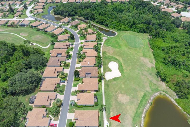 This home is located on the 14th fairway. The green is visible from this view.