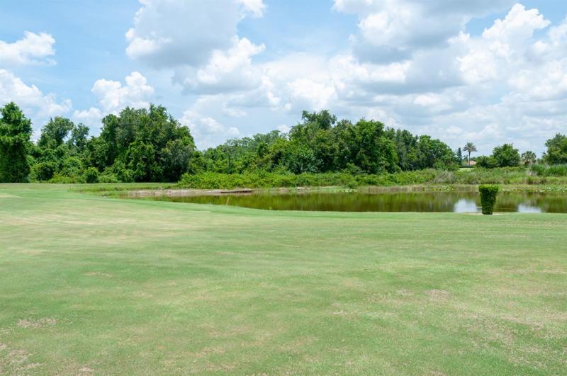 The view from the lanai is of golf course, pond, and nature preserve.