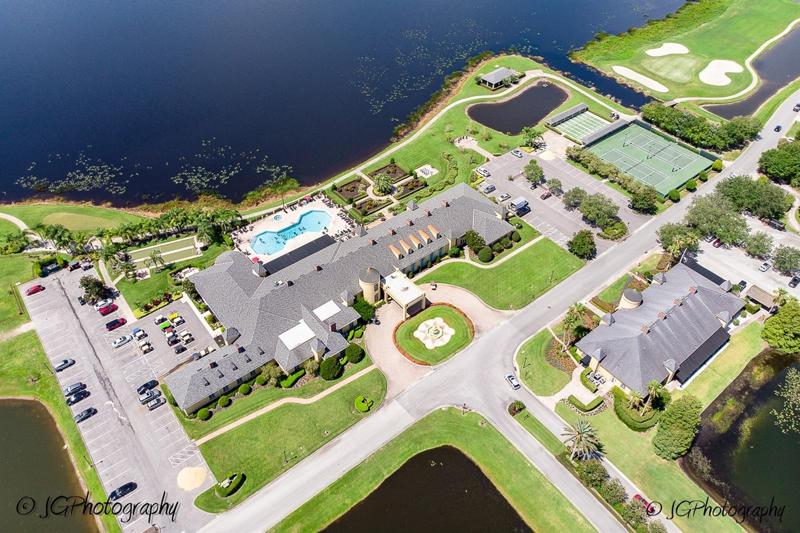 The main clubhouse grounds include lawn bowling/bocce, heated pool and spa, English garden, horseshoes, basketball, tennis, and shuffleboard. The community gazebo is in the background.