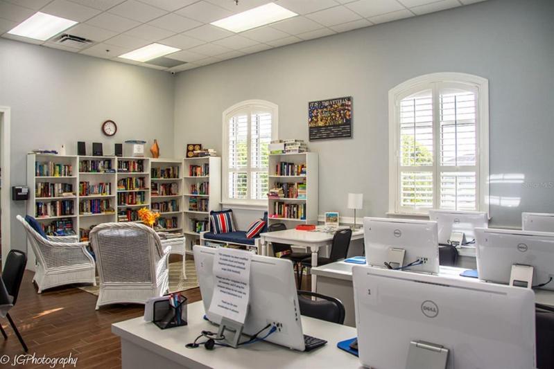 The Health and Fitness Center media room has computers for resident use and an honor system lending library.
