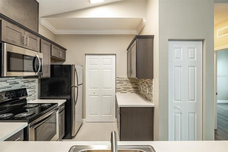 Laundry Room door is straight ahead! The Pantry Closet is to your right.