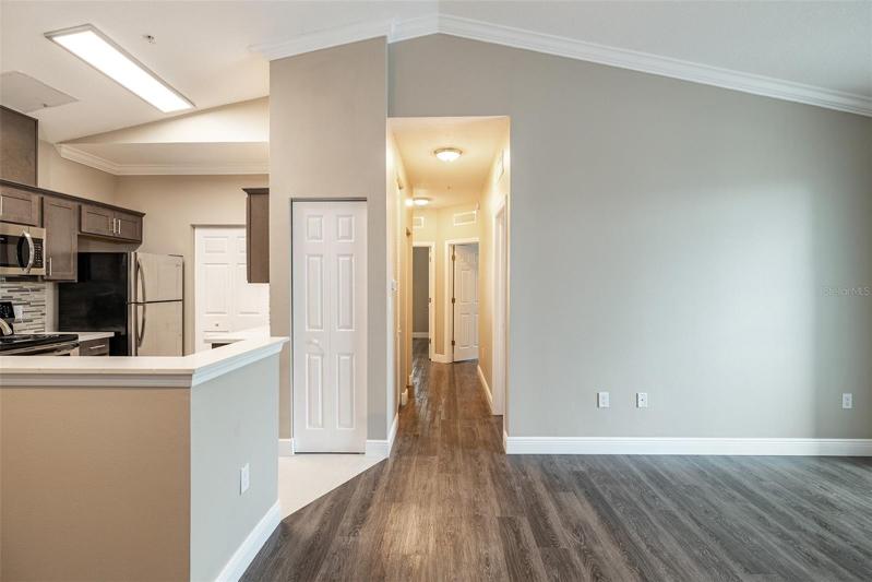 Hallway to 3 Additional Bedrooms! Did you notice the Vaulted Ceilings!  Feels huge!
