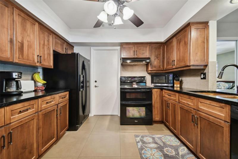 No faux in this kitchen. Real wood cabinetry is topped off with low maintenance soapstone countertops