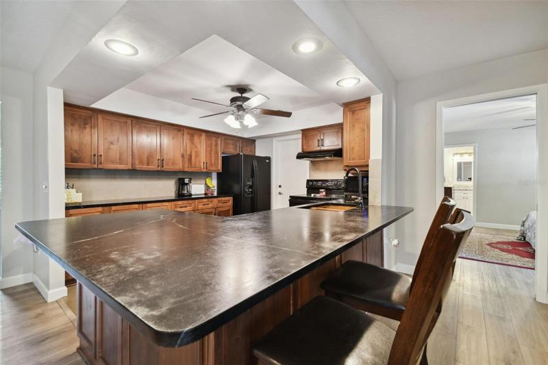 The parties all here and they can all fit at the expansive kitchen bar.