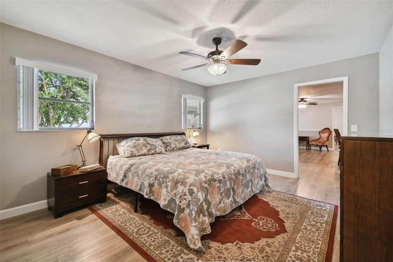 Plenty of space to fit your king size bed and furniture in this prime spot primary retreat located off the kitchen and family room.