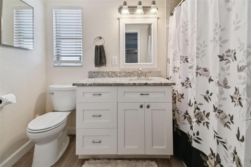 Updated cabinetry and countertops and a large shower (no climbing over a tub) round out the primary bathroom