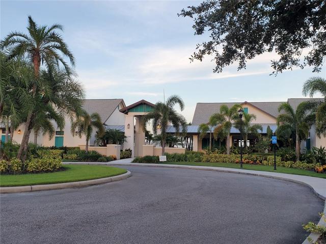 Entrance to main Clubhouse with fitness center, 70 acre lake, Olympic size pool, kids splash park, picnic areas, gazebos and so much more.