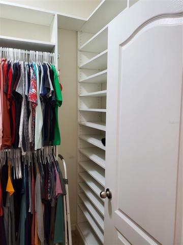 Lots of storage options in primary walk-in closet