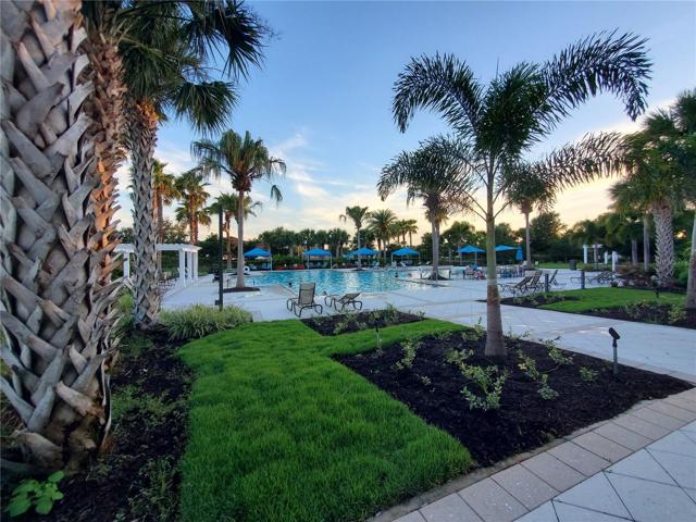 Community pool with beautiful landscaping, lots of gazebos and seating options