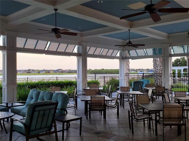 Relax in this poolside gathering area with a great view of the lake