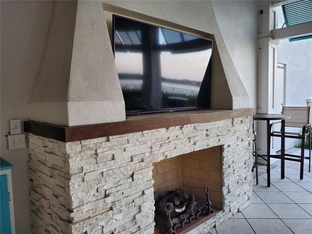 Poolside fireplace and TV a great spot to watch the big game with friends
