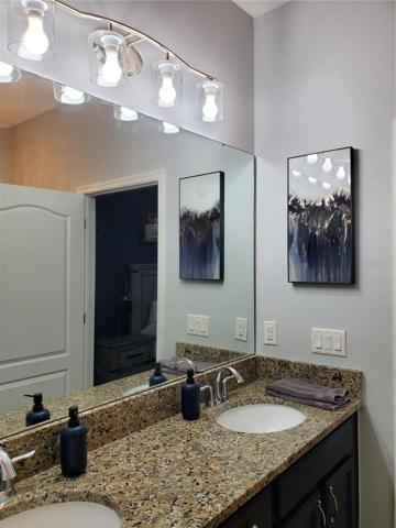 Beautiful wood cabinets with granite counter tops and updated lighting