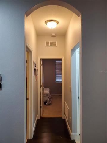 entrance to 2nd bedroom. Laundry is to the left, garage is to the right.