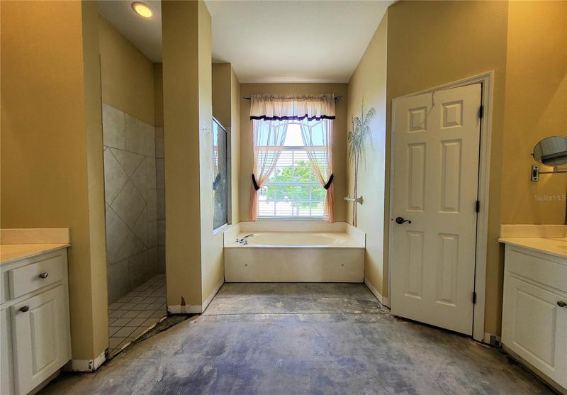 The large Master Bathroom just needs flooring, and toilet reinstalled