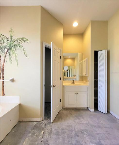 Other vanity on opposite side, between toilet and linen closet