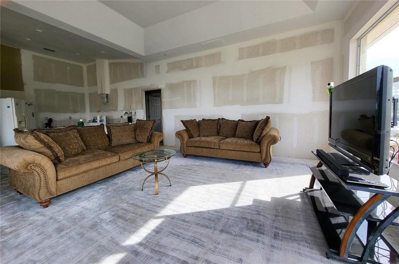 Large floor tiles, installed on the diagonal throughout the house, could be one option to tie every room together