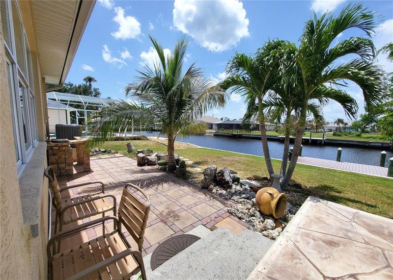 Step down from the pool deck to this wide, paved patio. Perfect for your grill and entertaining