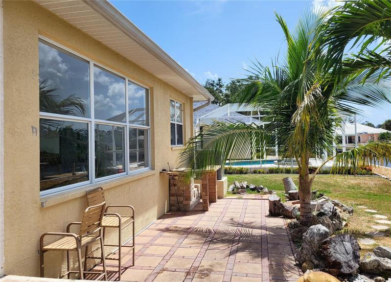 Perfect spot for grillin' & chillin'! There is a firepit just hidden behind the palm tree