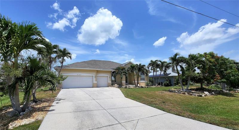 Mature landscaping, with several palms. This is Florida!