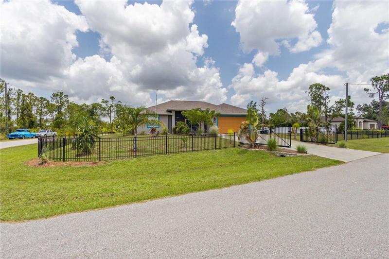 Double lot, fenced, gated. landscaped