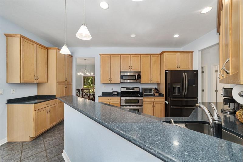 Solid surface counters, wood cabinets