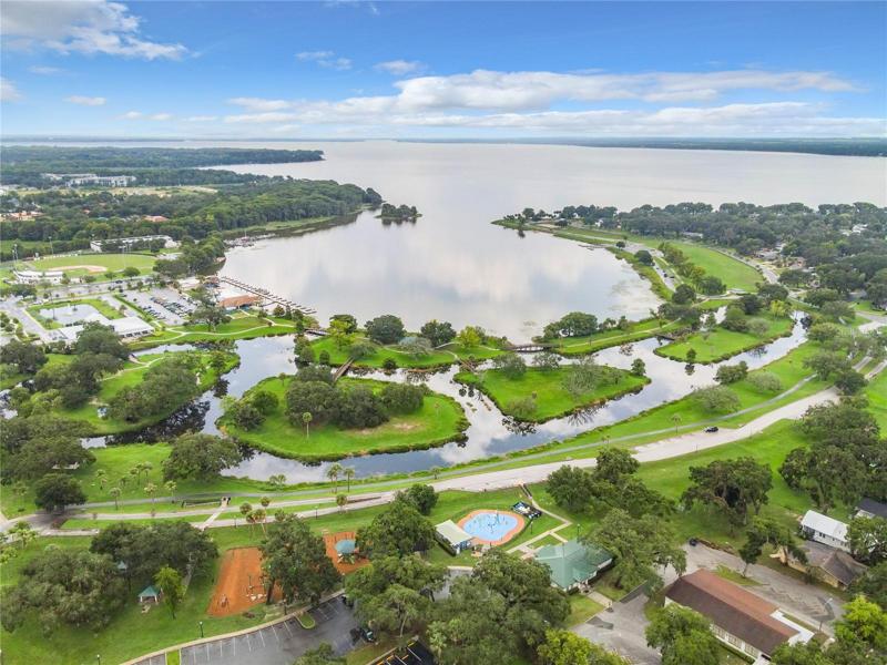 Ariel view of park, gardens, lake, and marina