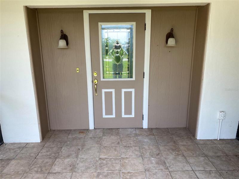 Front Door, with large porch to look down the canal across the street