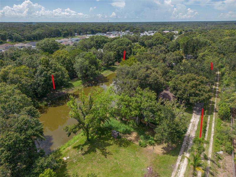 Full pond view. Property borders marked