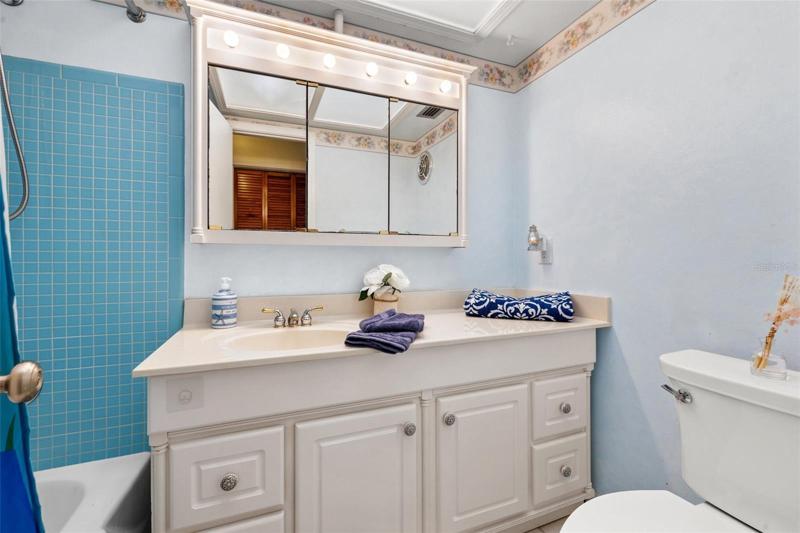 Full bath with tub/ shower combo.