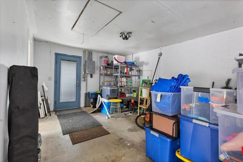 DETACHED GARAGE-DOOR THAT LEADS OUT TO SIDWALK TO HOME