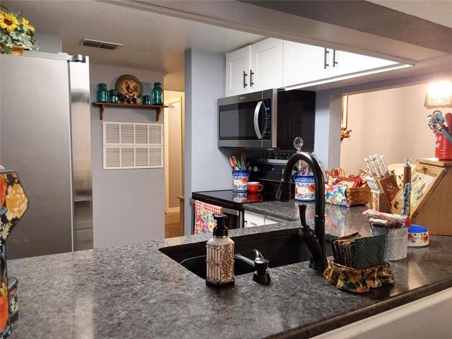 Quartz counters, Farmers sink, fixtures, Stainless steel appliances and all new cabinetry