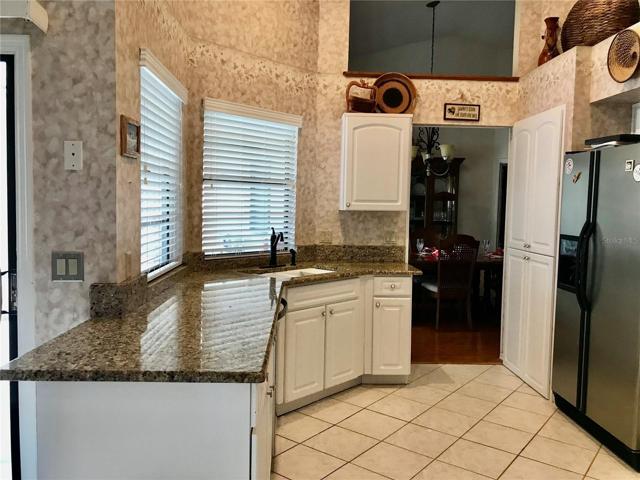 Kitchen pass-thru to den; plumbed for wet bar.