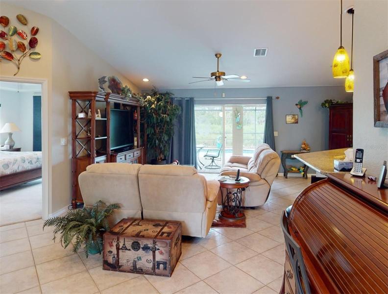 Living area with sliders to pool area
