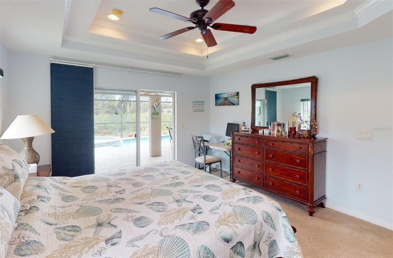 Master bedroom with sliders to pool deck